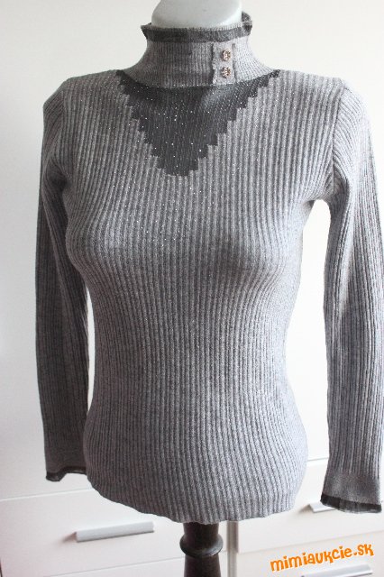 Zaujímavý pulovrik vpredu trblitky ...38...Nepremeškajte .